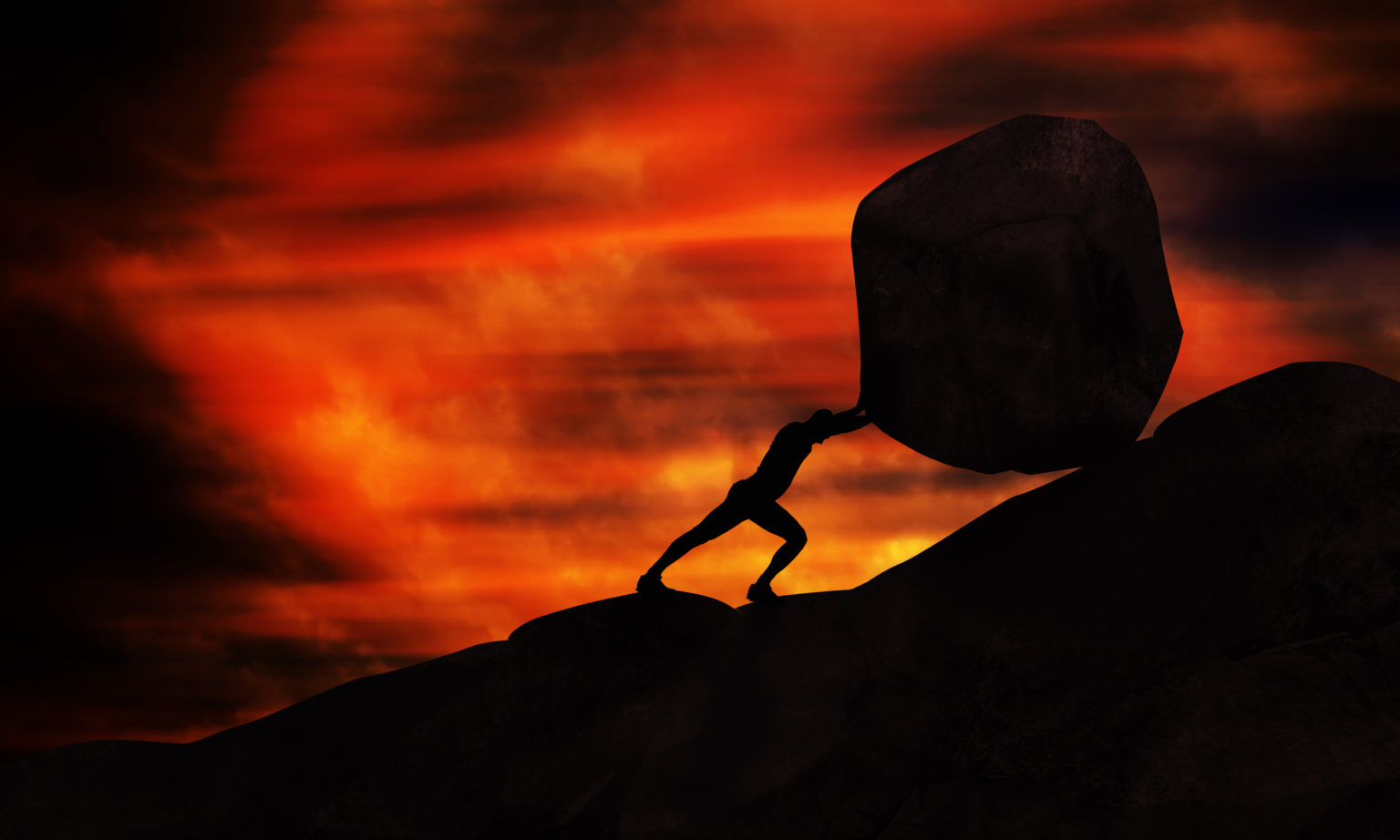 Image of a person pushing a large boulder uphill